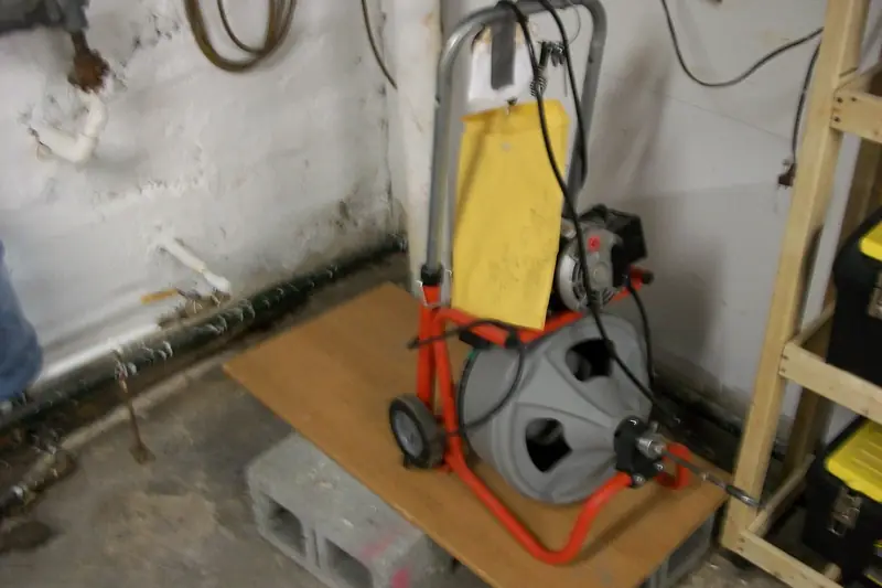 Drum drain cleaner by a drain