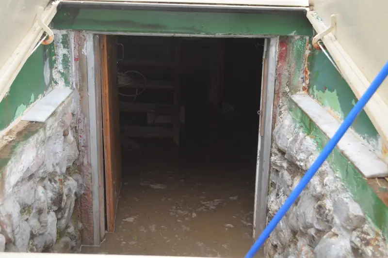 Flood water inside a basement doorway