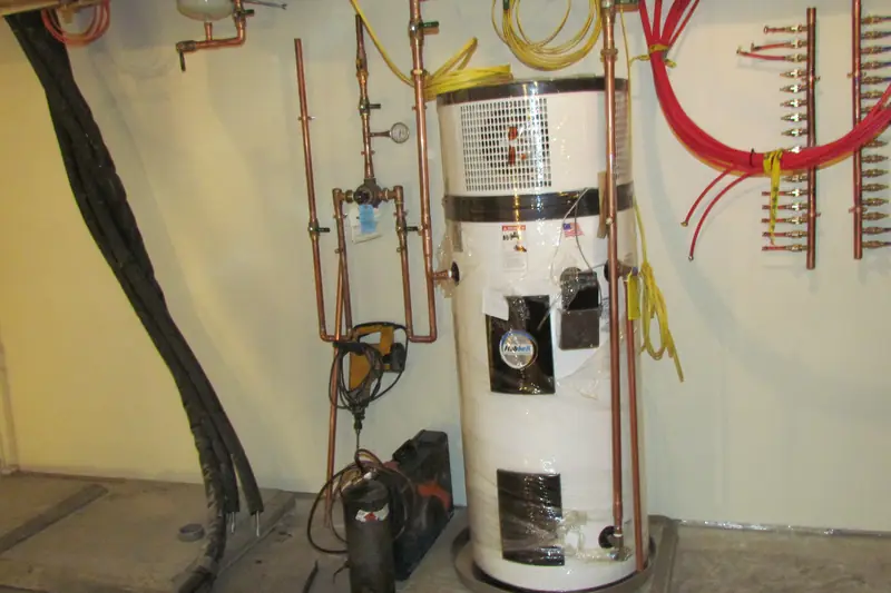 A heat-pump water heater in a basement utility room