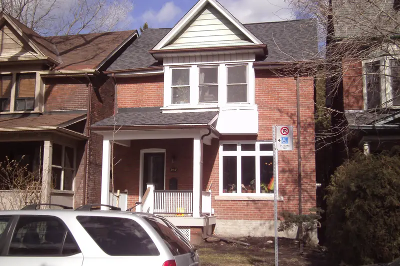 Red-brick Toronto house with a porch